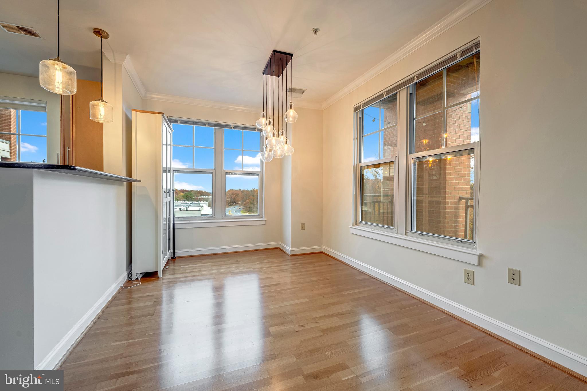 11770 Sunrise Valley Drive, Unit 321 Reston, VA 20191 - Photo 8 of 36 a view of a kitchen with a refrigerator and a window