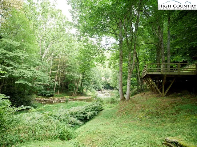 a view of outdoor space with deck and yard