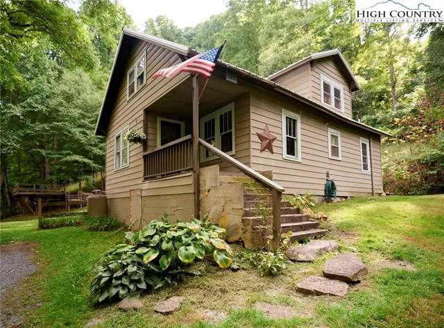 a backyard of a house with outdoor seating
