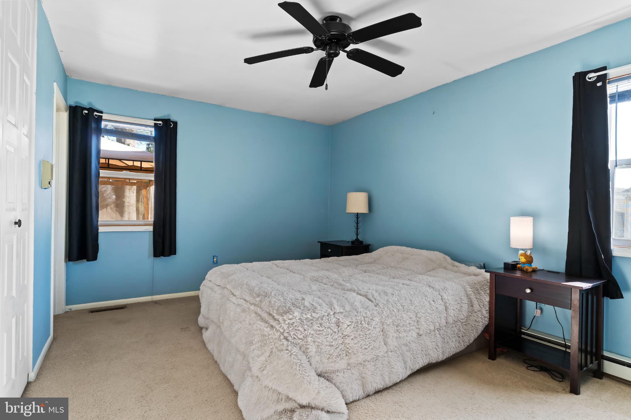 1434 Yorktowne Road Mechanicsburg, PA 17050 - Photo 19 of 30 Serene blue bedroom with cozy ambiance.