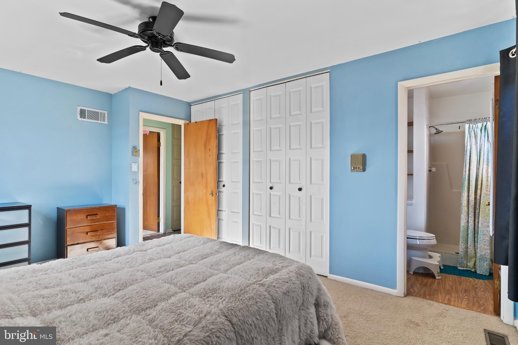 1434 Yorktowne Road Mechanicsburg, PA 17050 - Photo 20 of 30 Serene blue bedroom with ample storage.