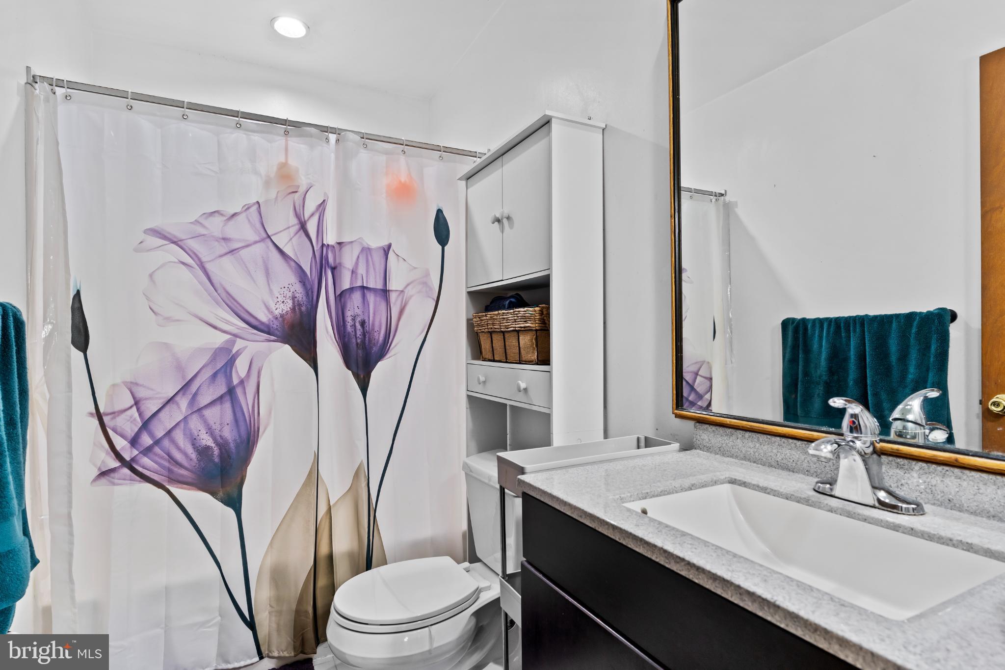 1434 Yorktowne Road Mechanicsburg, PA 17050 - Photo 25 of 30 Serene bathroom with floral accents.