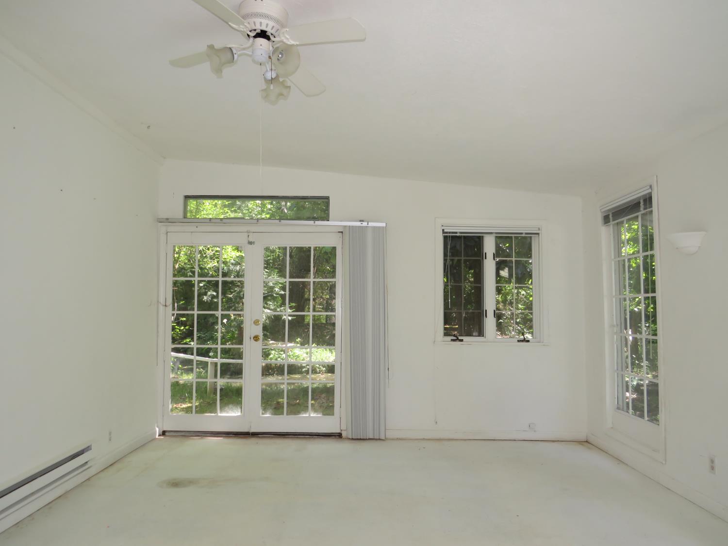 24040 Tokayana Way Colfax, CA 95713 - Photo 9 of 70 Sunroom with French doors to the backyard pond.