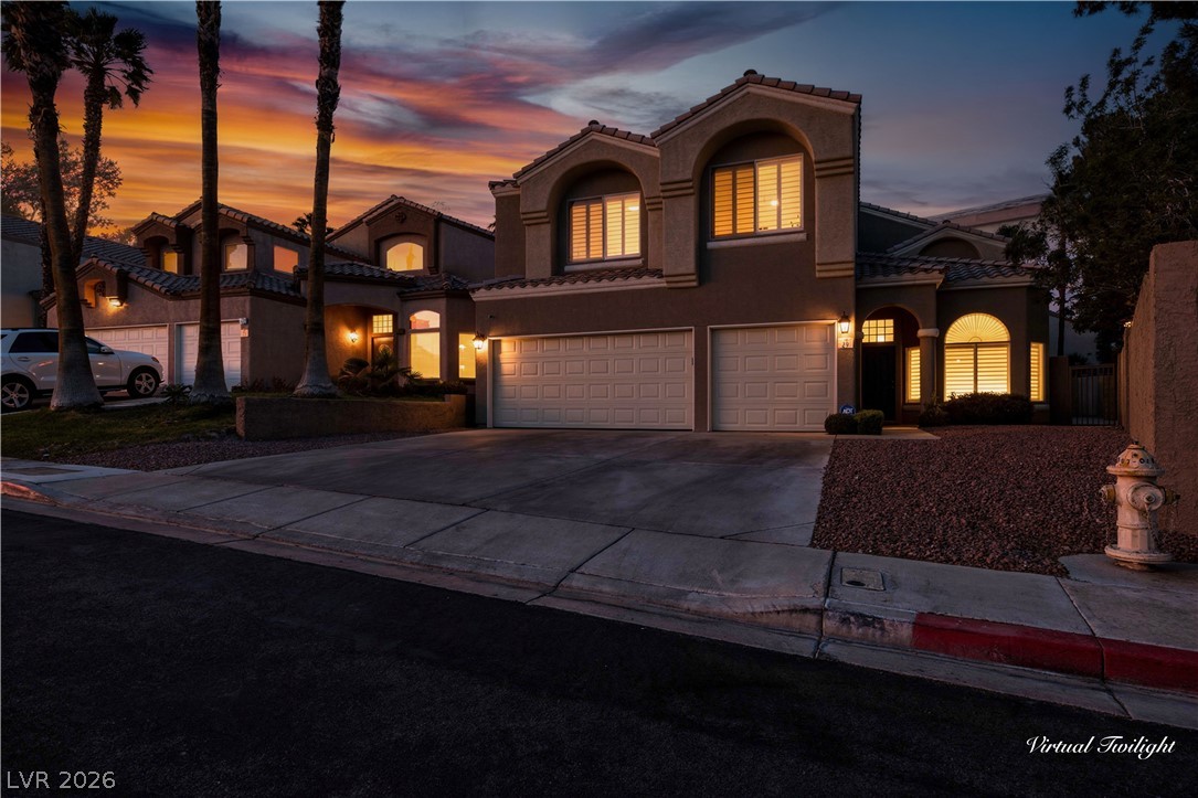 29 Olive Tree Henderson, NV 89074 - Photo 2 of 60 This residence features a stucco exterior and a convenient attached garage, perfect for modern living.