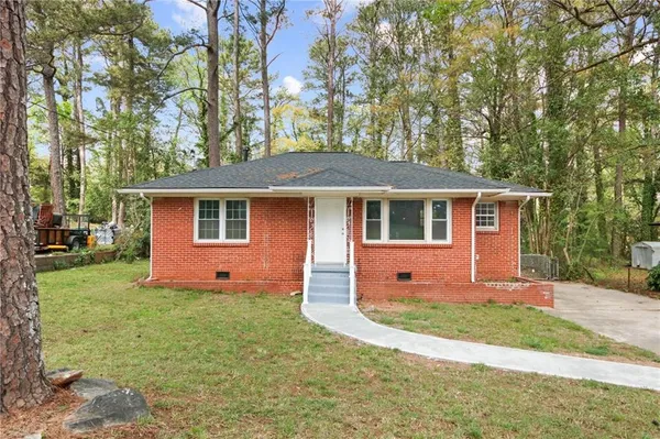 front view of a house with a yard