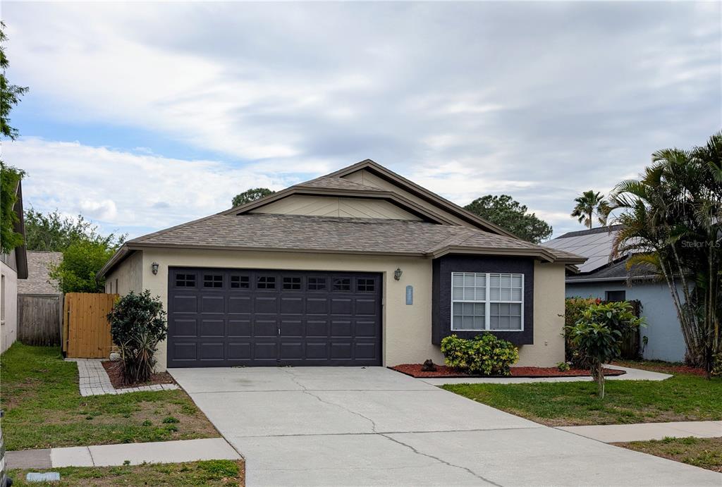 1442 Tiverton Drive Brandon, FL 33511 - Photo 1 of 1 a front view of a house with garden