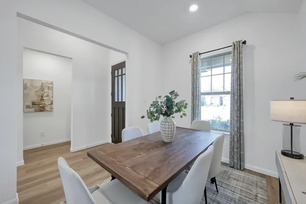 a room with a table and chairs