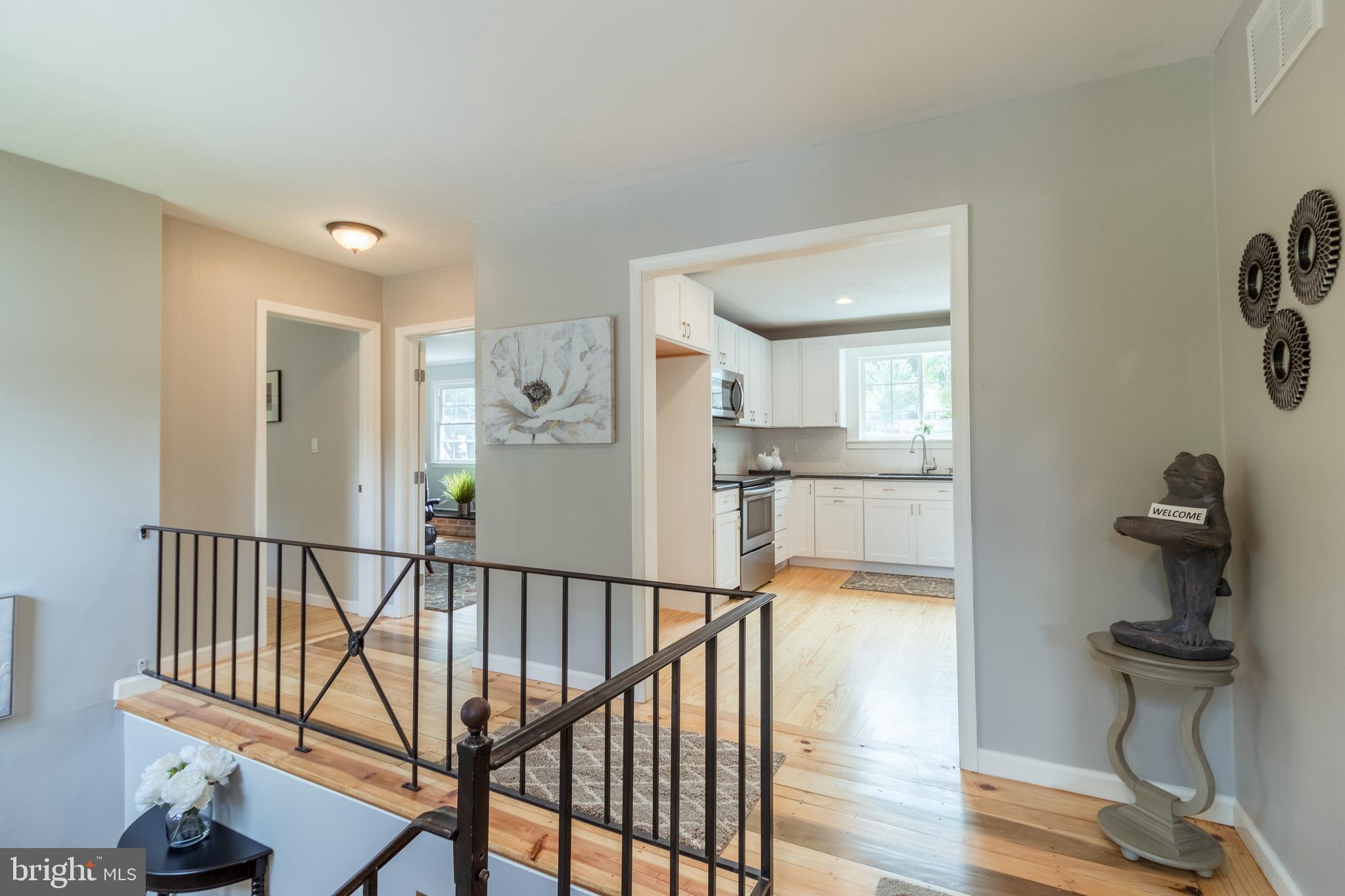 38 Vansant Road Newark, DE 19711 - Photo 4 of 42 Upstairs hallway with wrought iron railing