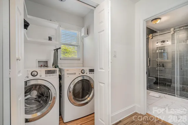 a view of a hallway with washer and dryer