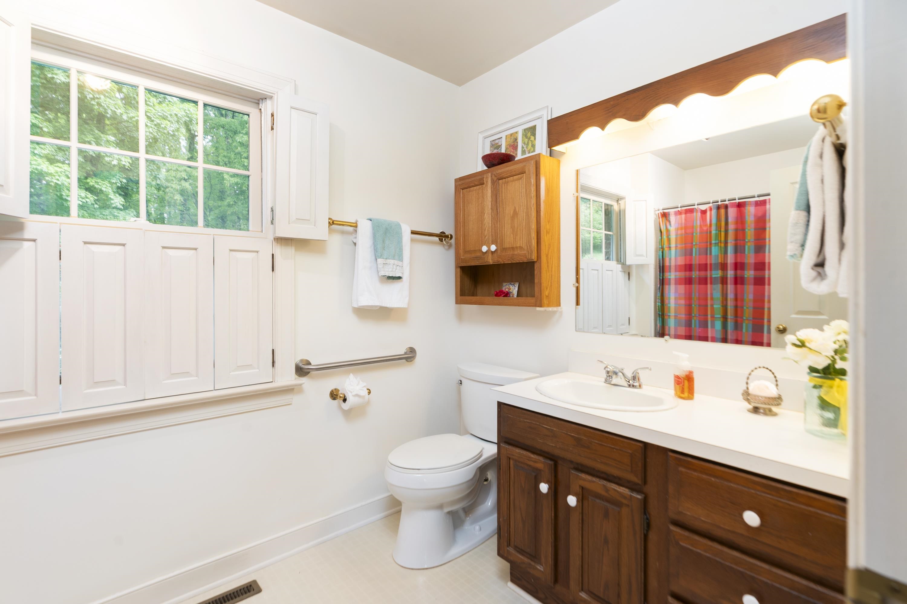 1430 Dogwood Road Staunton, VA 24401 - Photo 42 of 68 a bathroom with a sink a toilet and a window