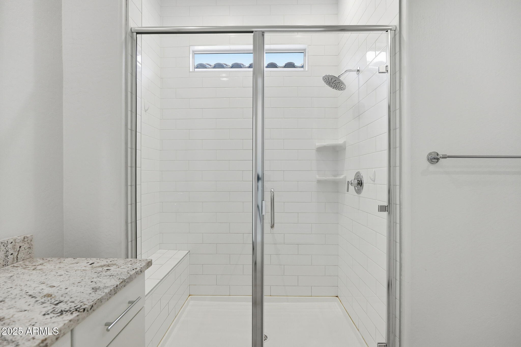 9749 East Tahoe Avenue Mesa, AZ 85212 - Photo 12 of 41 a bathroom with a granite countertop shower and a mirror