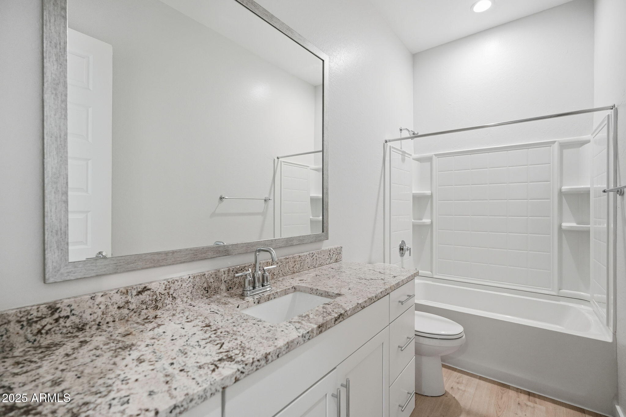 9749 East Tahoe Avenue Mesa, AZ 85212 - Photo 13 of 41 a bathroom with a granite countertop sink toilet and shower