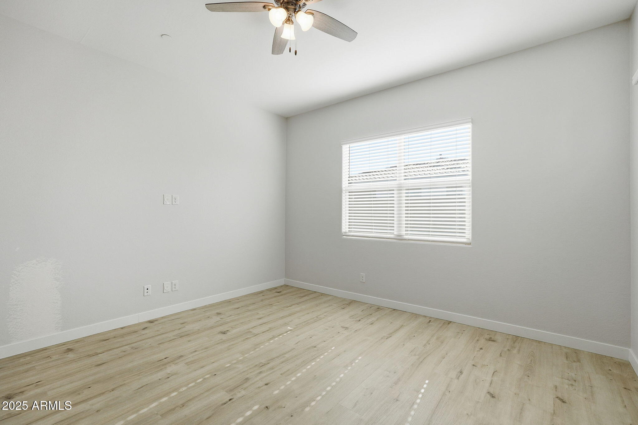 9749 East Tahoe Avenue Mesa, AZ 85212 - Photo 18 of 41 an empty room with a window