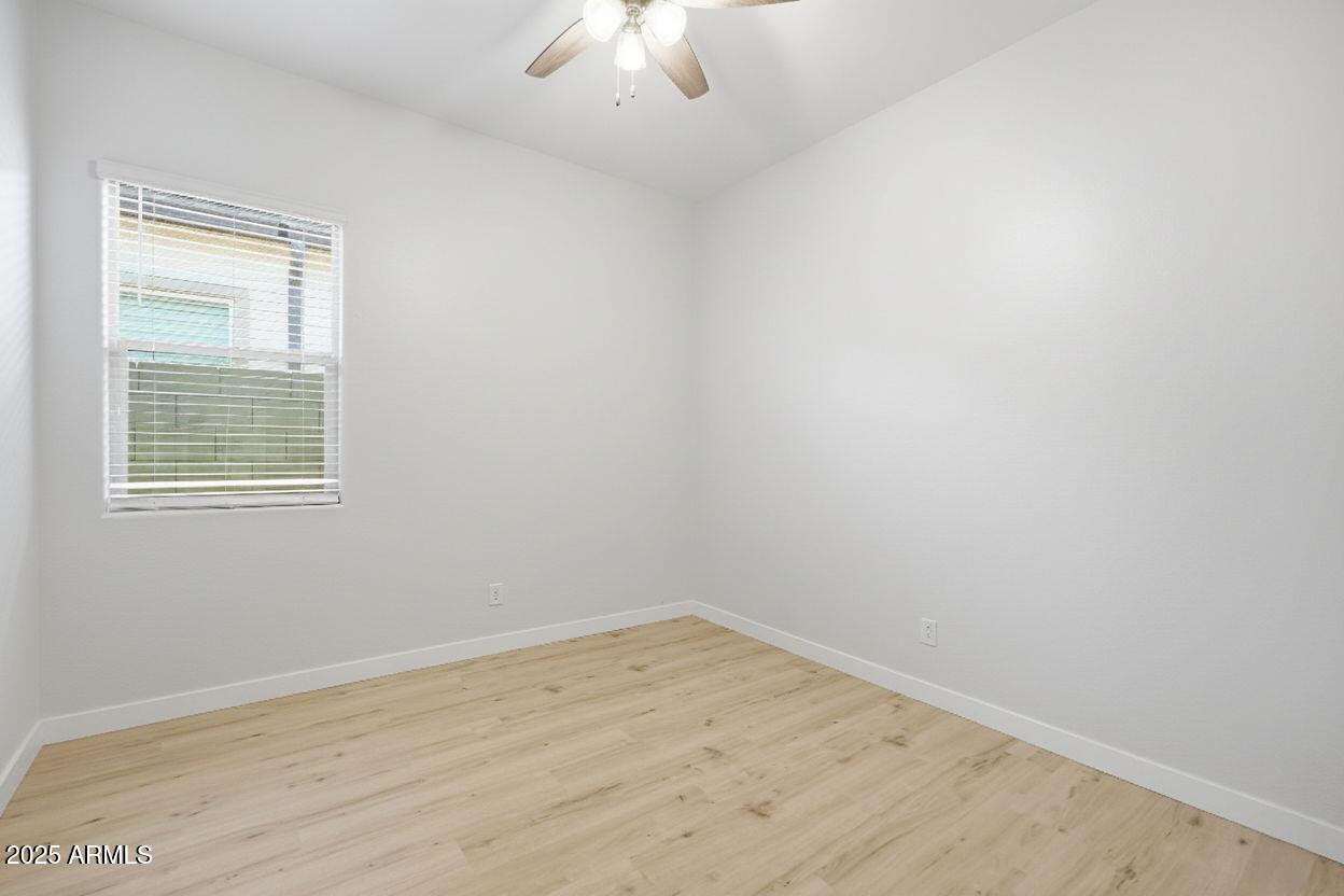 9749 East Tahoe Avenue Mesa, AZ 85212 - Photo 19 of 41 an empty room with a window