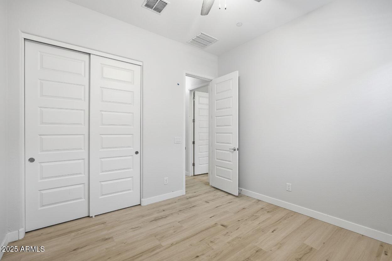 9749 East Tahoe Avenue Mesa, AZ 85212 - Photo 20 of 41 an empty room with closet area