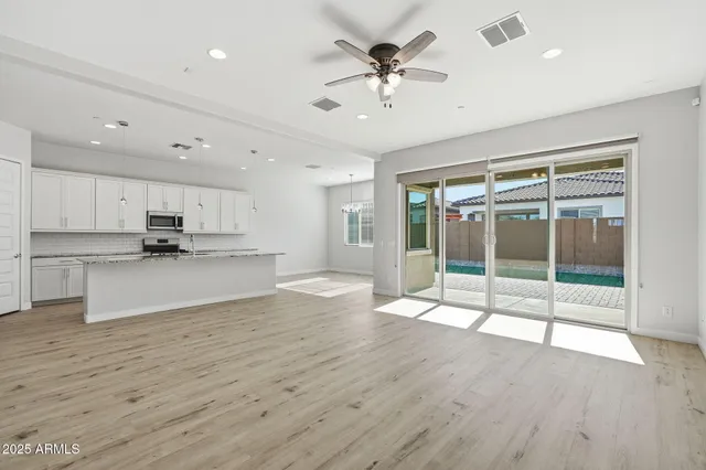 a view of a kitchen with a sink and a stove top oven