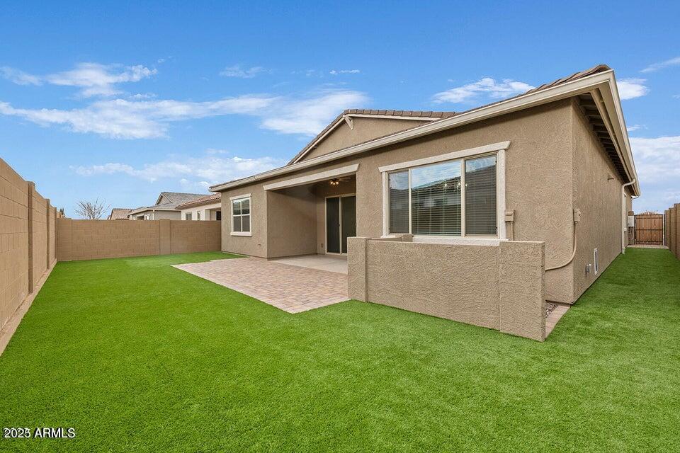 9749 East Tahoe Avenue Mesa, AZ 85212 - Photo 25 of 41 a view of a house with a backyard