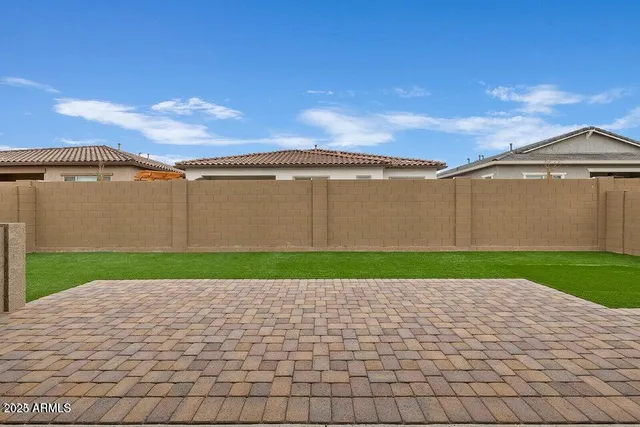a view of a back yard of the house