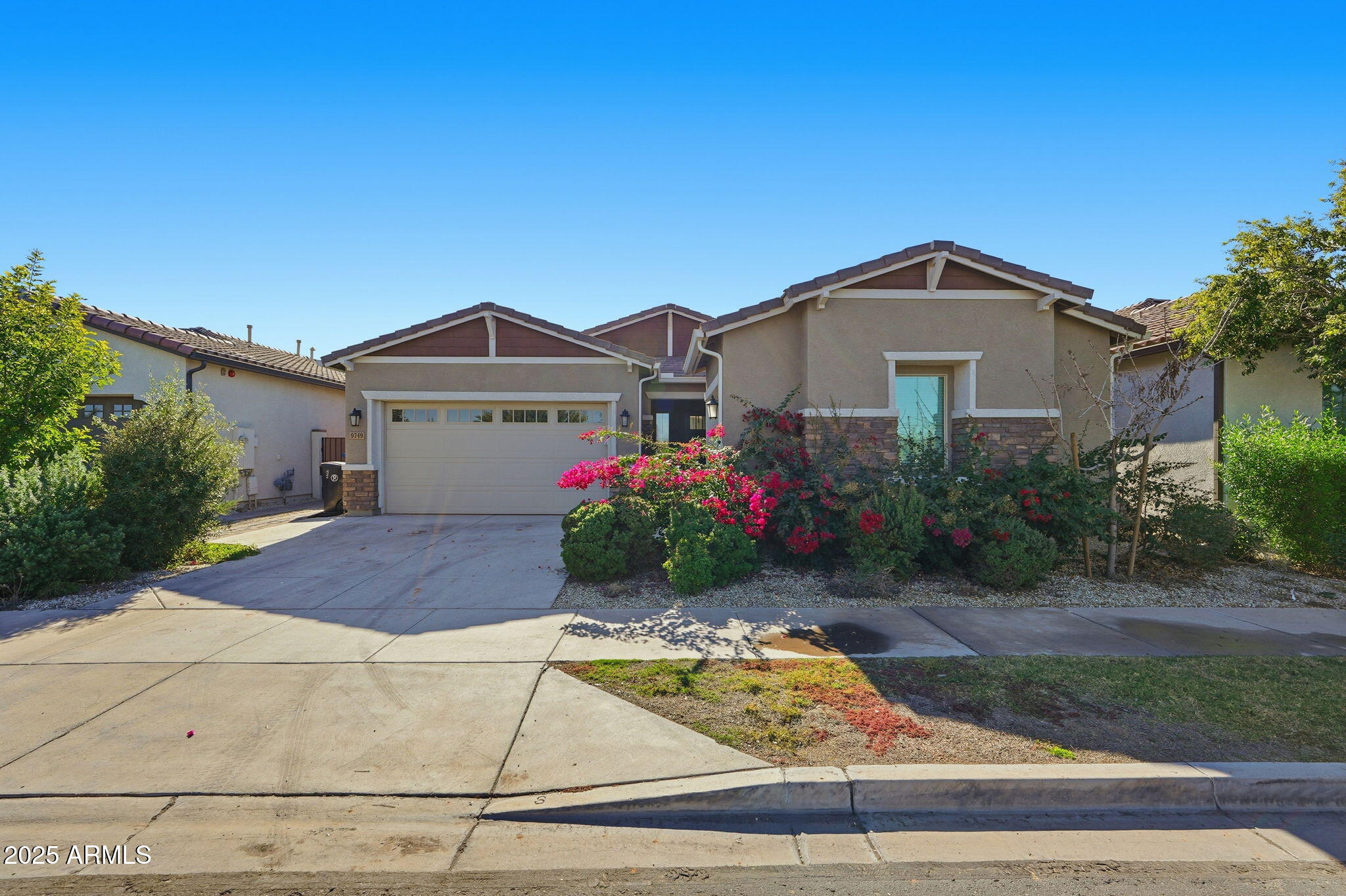 9749 East Tahoe Avenue Mesa, AZ 85212 - Photo 30 of 41 a front view of a house with yard
