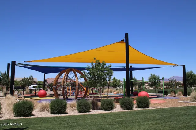 a view of swimming pool is middle in the garden