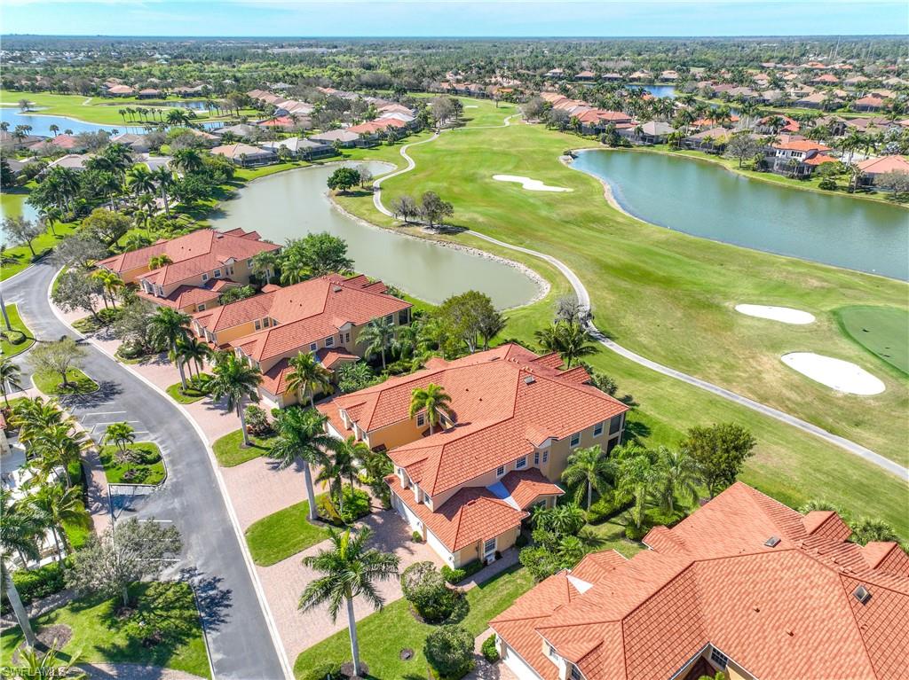 8613 Champions Point, Unit 302 Naples, FL 34113 - Photo 2 of 41 an aerial view of residential houses with outdoor space