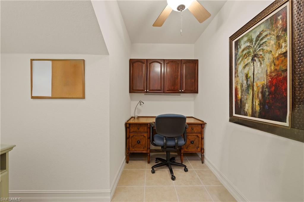 8613 Champions Point, Unit 302 Naples, FL 34113 - Photo 24 of 41 a workspace with furniture and a window