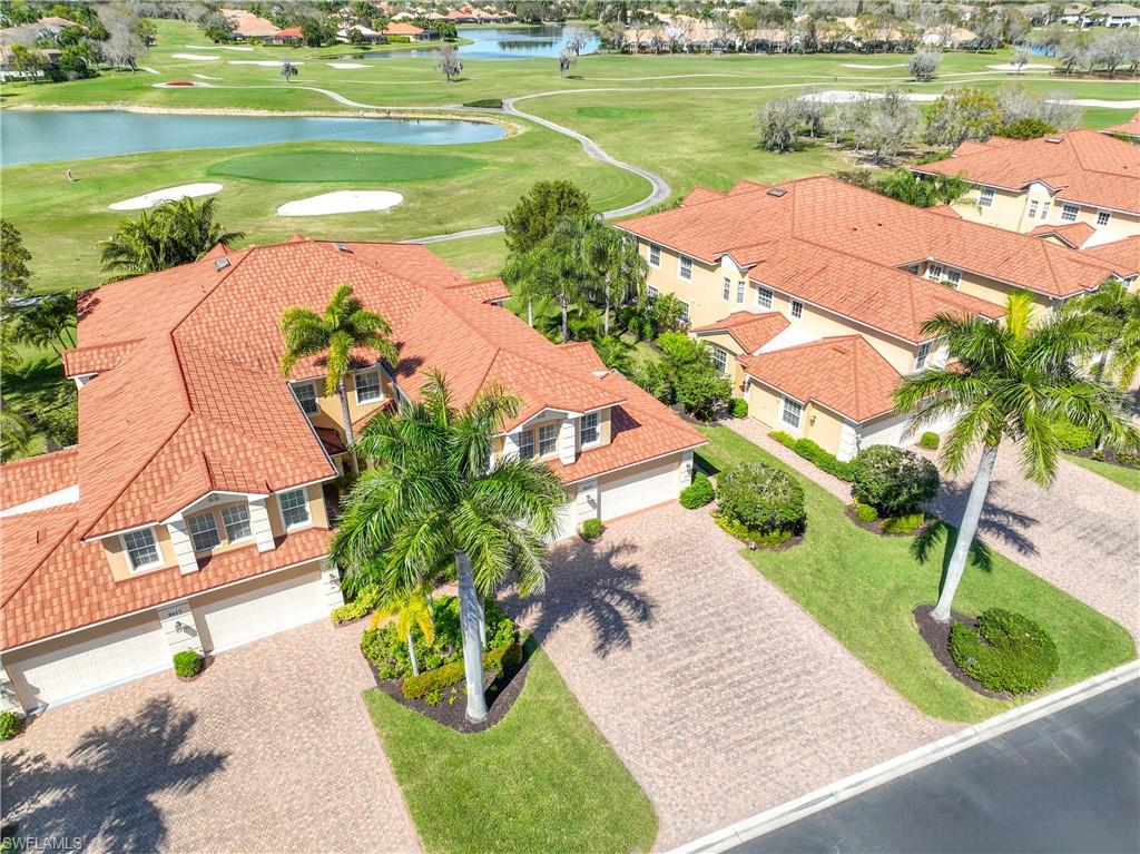 8613 Champions Point, Unit 302 Naples, FL 34113 - Photo 28 of 41 a view of a lake with a beach