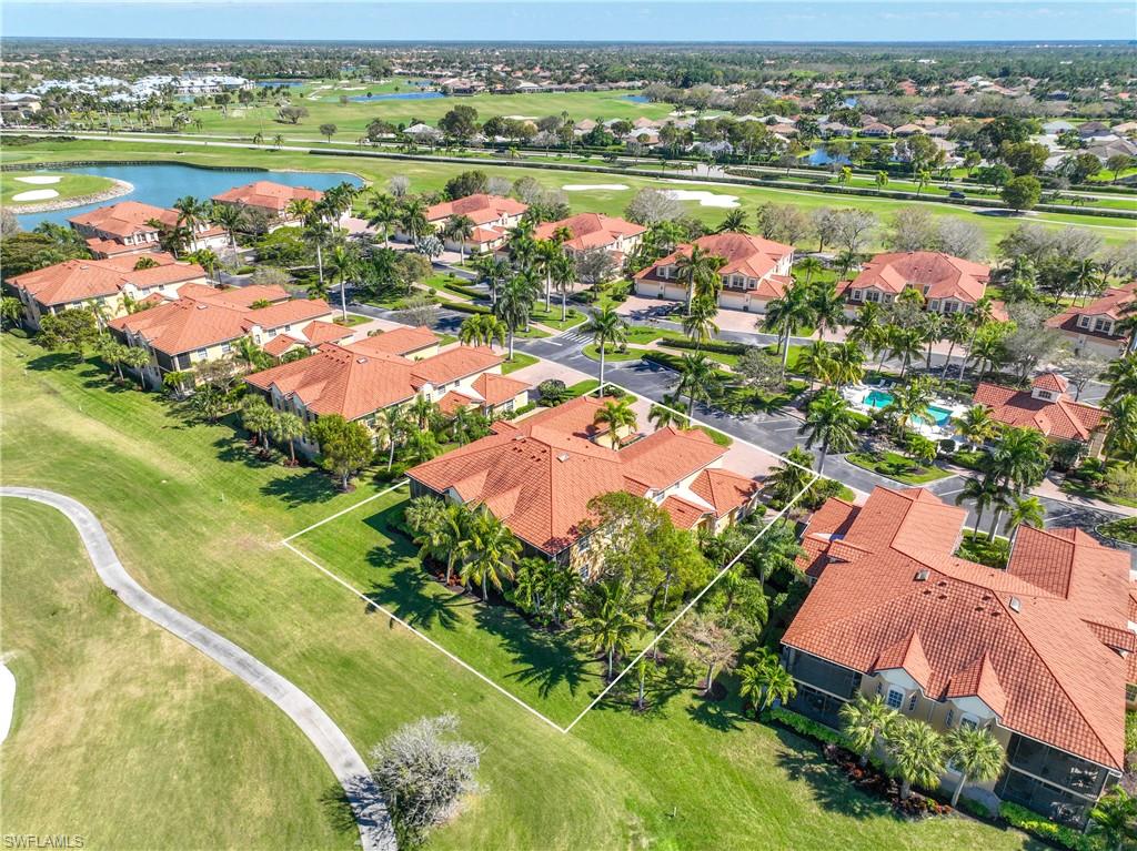 8613 Champions Point, Unit 302 Naples, FL 34113 - Photo 29 of 41 an aerial view of a houses with outdoor space and lake view