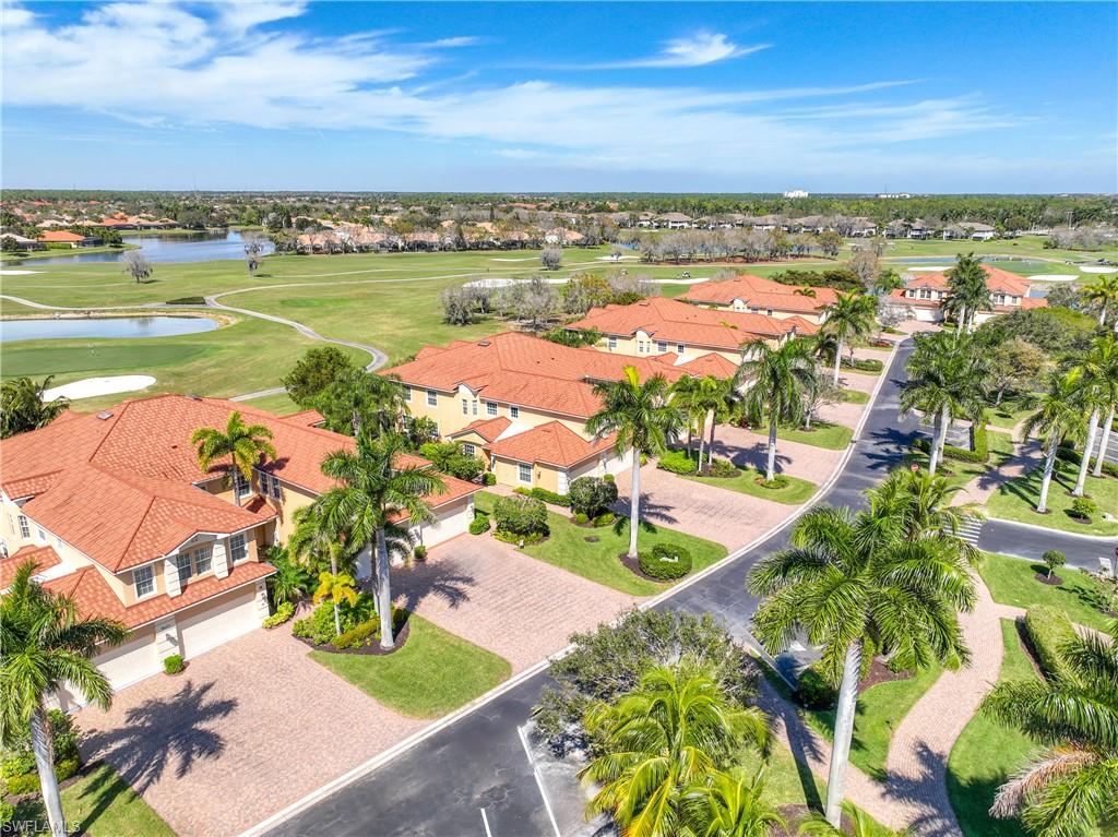 8613 Champions Point, Unit 302 Naples, FL 34113 - Photo 32 of 41 an aerial view of ocean and residential houses with outdoor space