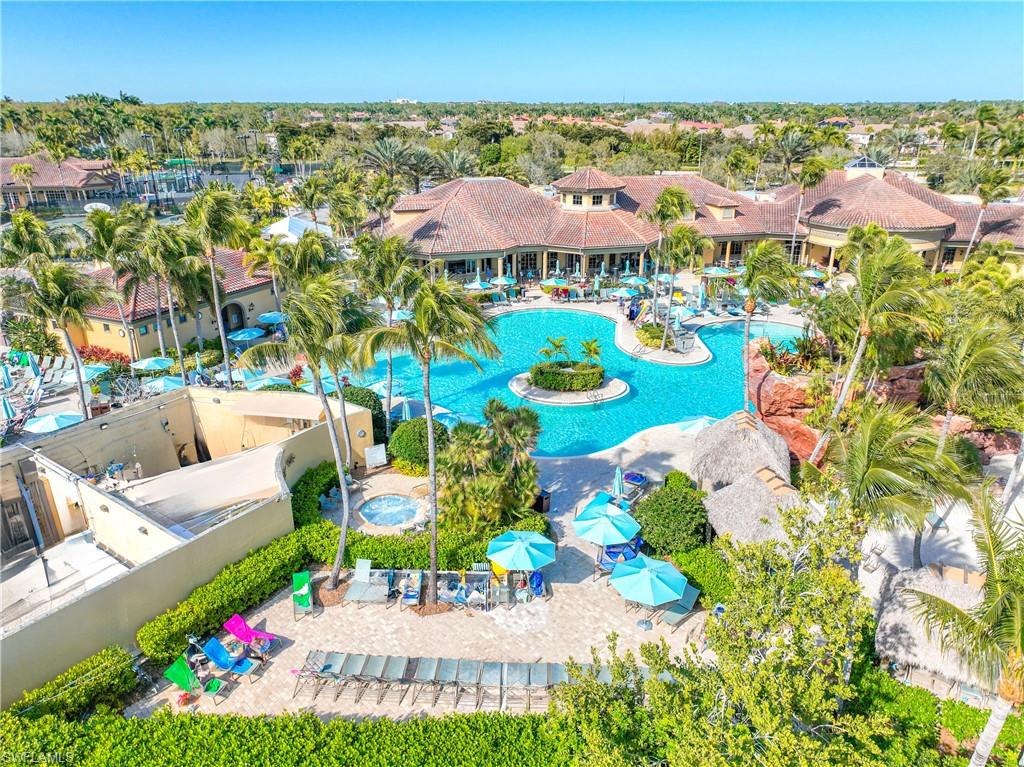 8613 Champions Point, Unit 302 Naples, FL 34113 - Photo 40 of 41 a view of a swimming pool with lounge chair