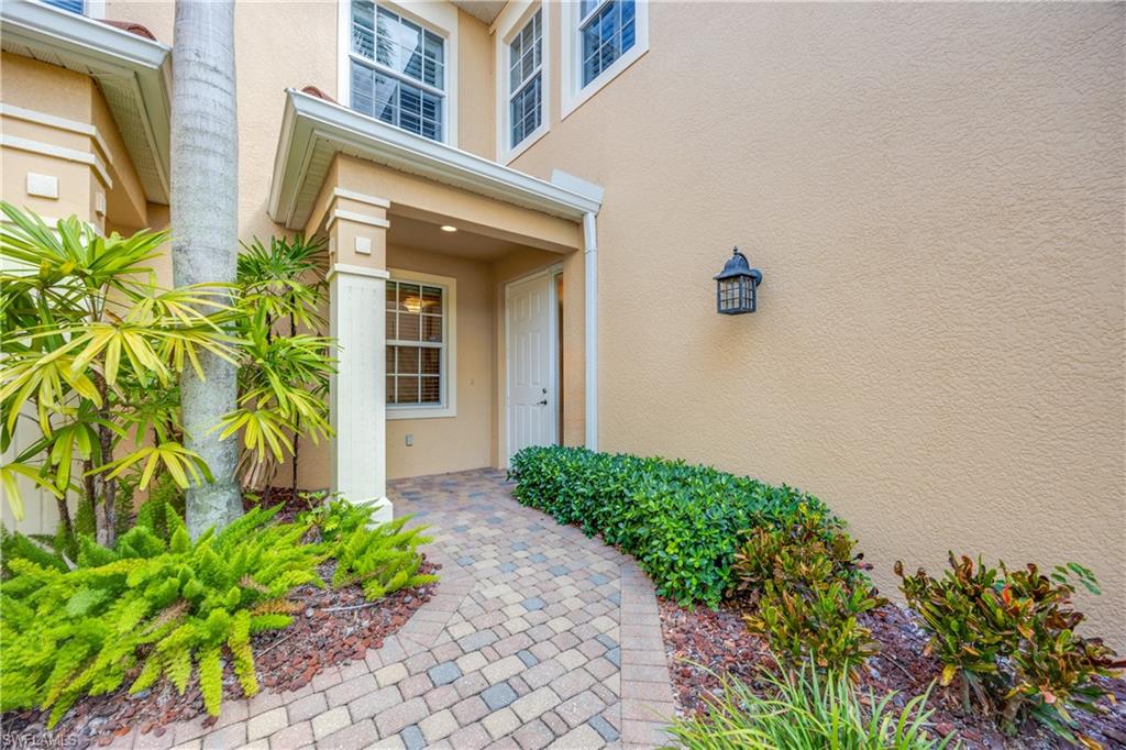 8613 Champions Point, Unit 302 Naples, FL 34113 - Photo 5 of 41 a front view of a house