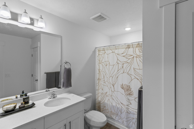 3003 South 265th Street West, Unit 751 Logan, UT 84321 - Photo 26 of 29 Bathroom featuring vanity and shower / bathtub combination with curtain