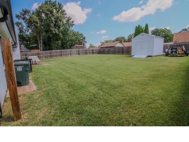 4902 Whitworth Road Memphis, TN 38116 - Photo 29 of 31 View of yard featuring a storage unit