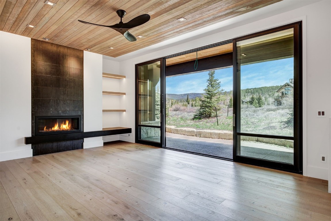 294 Gold Run Road Breckenridge, CO 80424 - Photo 19 of 50 a view of an empty room with a fireplace and a window