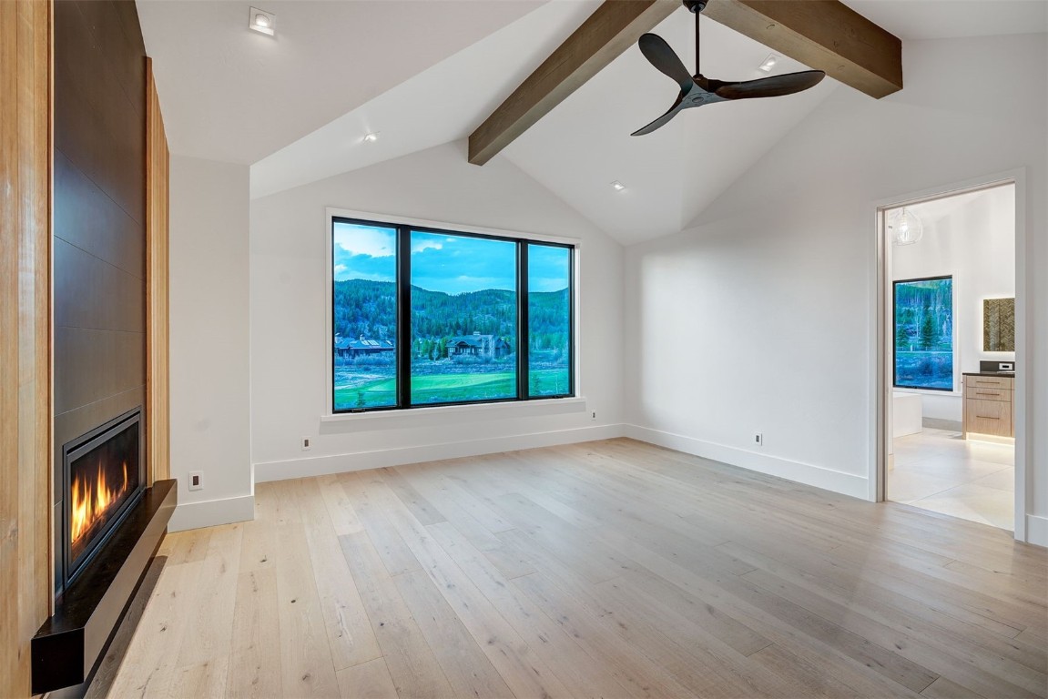 294 Gold Run Road Breckenridge, CO 80424 - Photo 22 of 50 a view of an empty room with wooden floor and a window