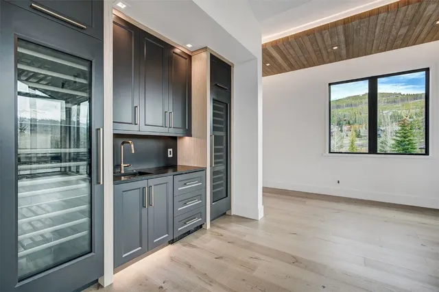 a kitchen with stainless steel appliances granite countertop a refrigerator and a stove top oven