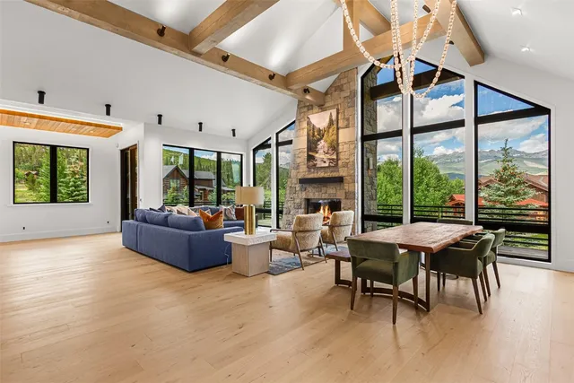 a view of a dining room with furniture window and wooden floor