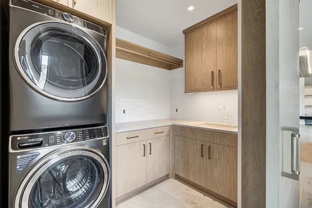 a view of a hallway with washer and dryer