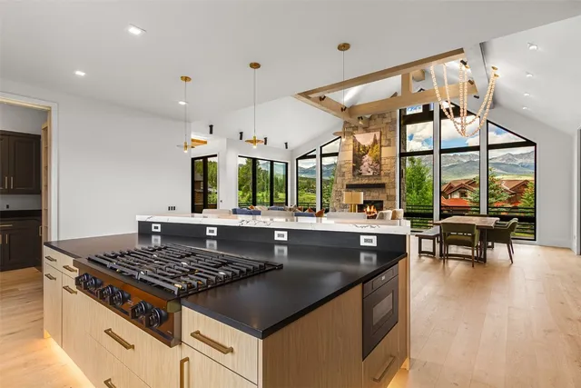 a kitchen with stainless steel appliances granite countertop a sink and a stove