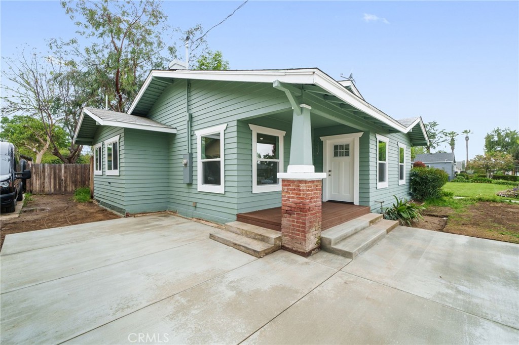 4400 Cover Street Riverside, CA 92506 - Photo 1 of 1 a front view of a house with garden