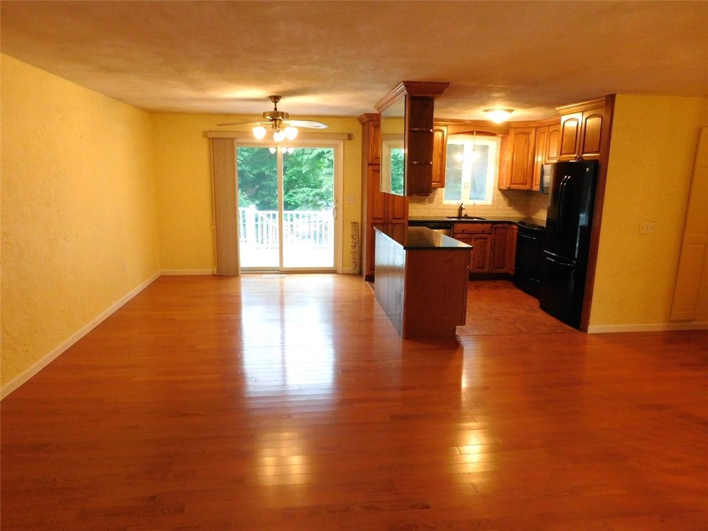 21 Partridge Drive Exeter, RI 02822 - Photo 3 of 25 Slider leads to a large deck to enjoy your backyard view