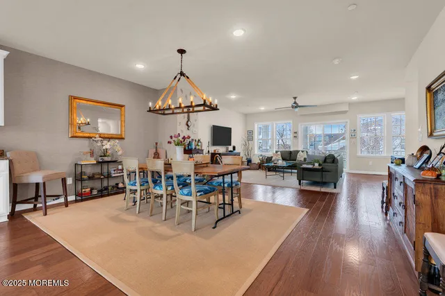 a kitchen with granite countertop a stove top oven a sink a counter space and cabinets