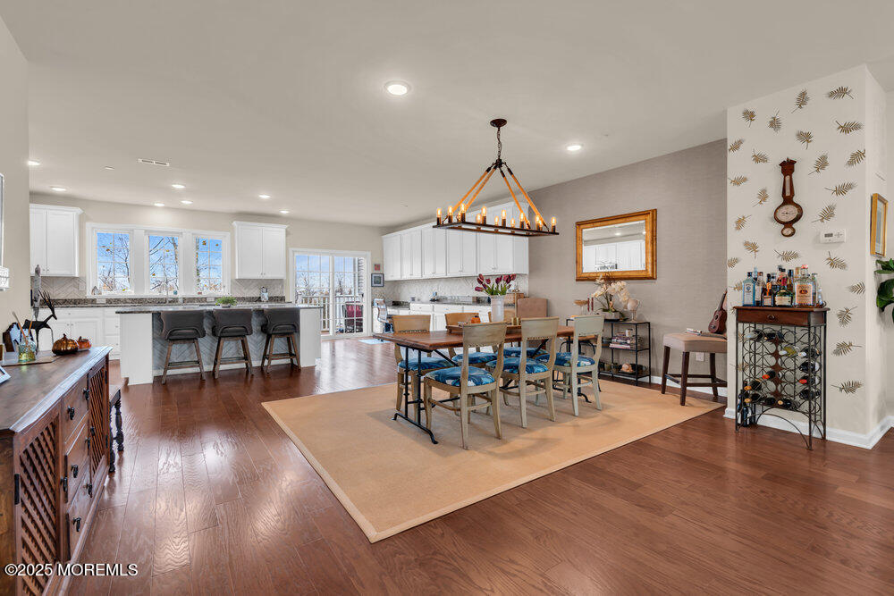24 Lighthouse Point Road Highlands, NJ 07732 - Photo 22 of 63 a view of a dining room with furniture and wooden floor