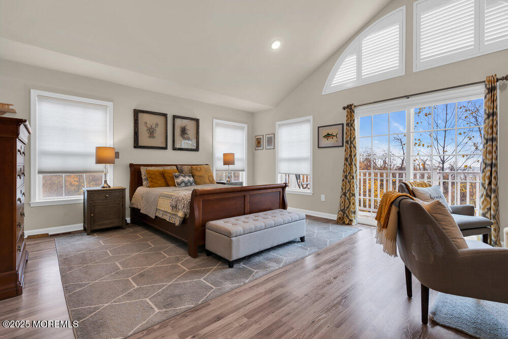 24 Lighthouse Point Road Highlands, NJ 07732 - Photo 33 of 63 a bedroom with furniture and a large window