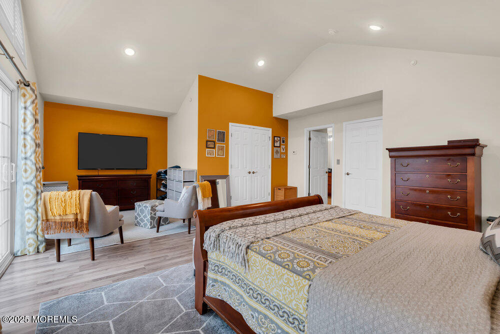 24 Lighthouse Point Road Highlands, NJ 07732 - Photo 38 of 63 a bedroom with a bed and a couch