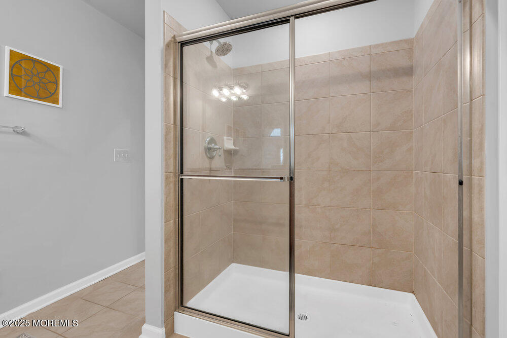 24 Lighthouse Point Road Highlands, NJ 07732 - Photo 40 of 63 a bathroom with a glass shower door