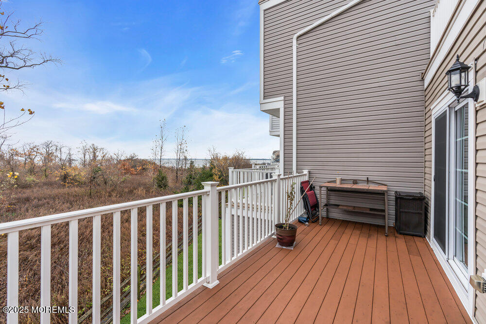 24 Lighthouse Point Road Highlands, NJ 07732 - Photo 47 of 63 a view of a balcony with wooden floor and city view