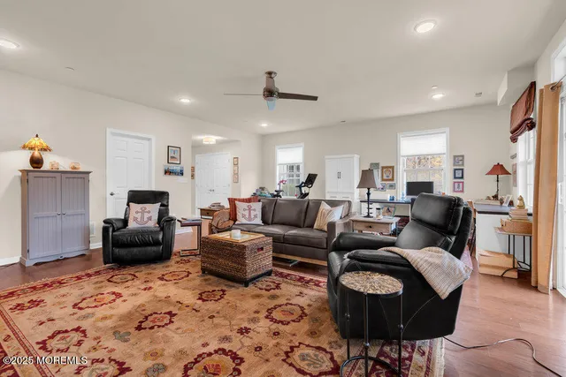 a kitchen with a sink a toilet a shower and a mirror