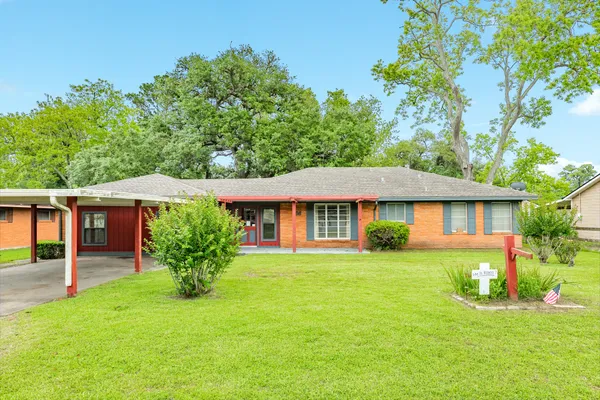 front view of a house with a yard