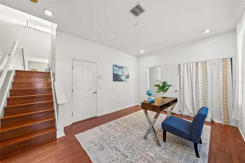 a room with furniture and wooden floor